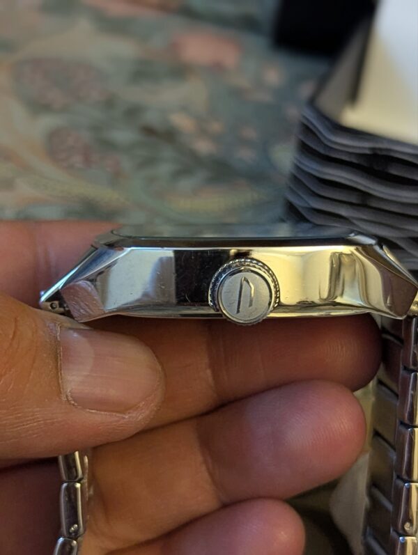 Diesel DZ1493,  Diesel "Scalped". A distinctive square, silver-tone stainless steel case and a matching link bracelet.