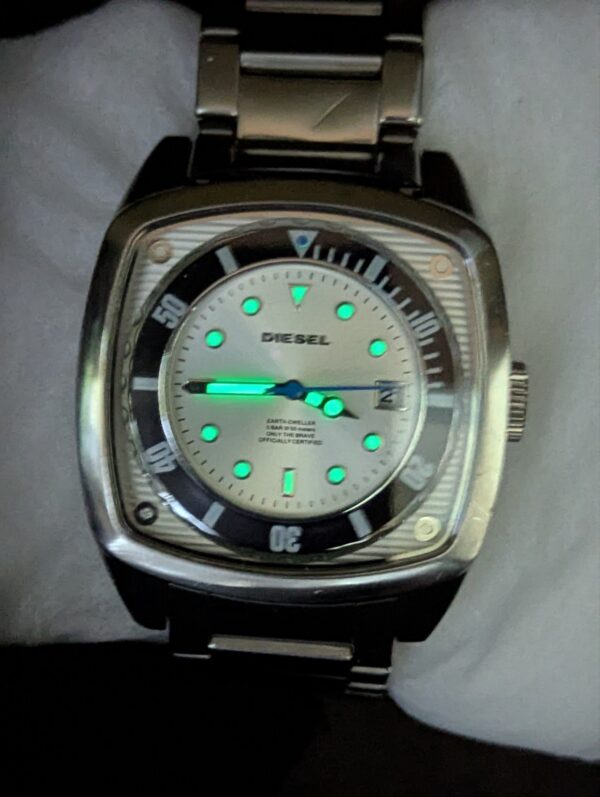 Diesel DZ1493,  Diesel "Scalped". A distinctive square, silver-tone stainless steel case and a matching link bracelet.